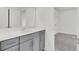 Clean and modern bathroom featuring gray cabinets, quartz countertops, and ample storage space at 528 Fern Tree Dr, Summerville, SC 29486