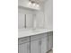Well-lit bathroom featuring gray vanity with a quartz countertop and large mirror at 528 Fern Tree Dr, Summerville, SC 29486