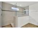 Modern bathroom with tiled walls, glass shower door, rain shower head, and wood look tiled flooring at 528 Fern Tree Dr, Summerville, SC 29486