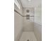 Modern bathroom with tiled walls, glass shower door, rain shower head, and built in shampoo niche at 528 Fern Tree Dr, Summerville, SC 29486