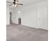 Spacious bedroom with neutral carpet, white walls, ceiling fan, and an ensuite bathroom at 528 Fern Tree Dr, Summerville, SC 29486