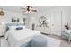 Bright bedroom featuring a ceiling fan, white walls, and a comfortable bed with blue accents at 528 Fern Tree Dr, Summerville, SC 29486