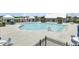 Large community pool with lounge seating and umbrellas at 528 Fern Tree Dr, Summerville, SC 29486