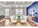 Dining room featuring coffered ceilings, a glass table with seating for six, and a bold accent wall at 528 Fern Tree Dr, Summerville, SC 29486