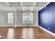 Dining room featuring coffered ceilings, a chandelier, and a bold accent wall at 528 Fern Tree Dr, Summerville, SC 29486