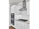 Modern kitchen featuring stainless steel appliances, white cabinets, and a stone countertop at 528 Fern Tree Dr, Summerville, SC 29486