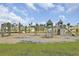 Community playground featuring swings, slides, and climbing structures amidst a residential neighborhood at 528 Fern Tree Dr, Summerville, SC 29486