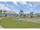 Community playground features slides and play structures, surrounded by green lawns and a community building at 528 Fern Tree Dr, Summerville, SC 29486
