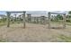 Community playground offers slides, swings, and play structures near palm trees and residential buildings at 528 Fern Tree Dr, Summerville, SC 29486