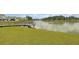 Scenic pond with a charming wooden pier and lush green lawn, perfect for relaxation at 528 Fern Tree Dr, Summerville, SC 29486