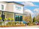Exterior shot of Poogan's Southern Kitchen with its blue logo and outdoor greenery at 570 Scholar Way, Summerville, SC 29486