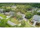 A lovely aerial view of a well-maintained two-story home surrounded by mature trees and waterfront access at 634 Lynne Ave, Charleston, SC 29412