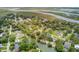 A tranquil aerial view of homes bordering winding waterways leading to coastal marshland and ocean access at 634 Lynne Ave, Charleston, SC 29412