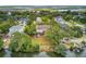 An aerial of the waterfront property featuring a deck, fire pit, and large trees at 634 Lynne Ave, Charleston, SC 29412