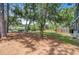 Spacious backyard with a fence, large trees, and outdoor seating area at 634 Lynne Ave, Charleston, SC 29412