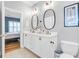 Elegant bathroom showcasing a double vanity, modern fixtures, and neutral decor, creating a serene and functional space at 634 Lynne Ave, Charleston, SC 29412