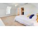 Spacious bedroom with a cozy bed, window seat, and access to additional rooms, offering a peaceful retreat at 634 Lynne Ave, Charleston, SC 29412