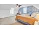 Comfortable bedroom with patterned accent wall, a cozy seating area, and warm natural light at 634 Lynne Ave, Charleston, SC 29412