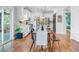 Open dining room with modern light fixture and easy access to the kitchen, breakfast area, and porch at 634 Lynne Ave, Charleston, SC 29412