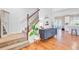 Inviting entryway with hardwood floors, staircase, decorative console table, and an open view into the living spaces at 634 Lynne Ave, Charleston, SC 29412
