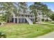 Stunning raised home with a spacious front yard and classic coastal charm at 634 Lynne Ave, Charleston, SC 29412