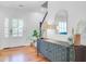 Bright Foyer featuring hardwood floors, decorative cabinet, mirror, staircase, and direct access to outside at 634 Lynne Ave, Charleston, SC 29412