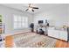 Bright home office space features hardwood floors, geometric rug, shuttered window, and contemporary desk setup at 634 Lynne Ave, Charleston, SC 29412