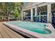 Inviting hot tub with water fountains on wooden deck, complemented by a covered bar area at 634 Lynne Ave, Charleston, SC 29412