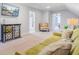 Comfortable living room showcasing a sofa, mirrored cabinet, a colorful armchair, and open doorways to other rooms at 634 Lynne Ave, Charleston, SC 29412