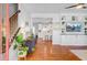 Bright and open living room with hardwood floors, built-in shelving, and seamless flow to kitchen at 634 Lynne Ave, Charleston, SC 29412