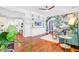 Spacious living room with built-in shelving, hardwood floors, and tropical wallpaper, creating a vibrant and modern living space at 634 Lynne Ave, Charleston, SC 29412