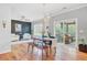 Bright living room with hardwood floors, dark accent wall, modern lighting, and access to the screened porch at 634 Lynne Ave, Charleston, SC 29412