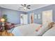 Comfortable main bedroom featuring a ceiling fan, neutral decor, and access to the en-suite bathroom and walk-in closet at 634 Lynne Ave, Charleston, SC 29412