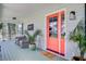 Charming porch with rocking chairs, vibrant plants, and a welcoming entrance at 634 Lynne Ave, Charleston, SC 29412