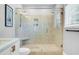 Modern walk-in shower featuring tiled walls, dual showerheads, and a built-in bench, offering a luxurious bathing experience at 634 Lynne Ave, Charleston, SC 29412