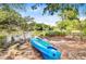 Waterfront property with sandy bank, a kayak and trees on a sunny day at 634 Lynne Ave, Charleston, SC 29412