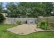 Charming backyard with a gravel area, built-in bench seating, and a cozy fire pit perfect for outdoor relaxation at 7164 Sweetgrass Blvd, Hanahan, SC 29410