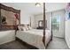 Bedroom with a four poster bed, neutral tones and a tapestry on the wall at 7164 Sweetgrass Blvd, Hanahan, SC 29410