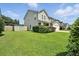Charming two-story home with a well-manicured lawn and attached garage on a sunny day at 7164 Sweetgrass Blvd, Hanahan, SC 29410