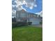 Charming two-story home featuring a well-manicured lawn, and a two car garage at 7164 Sweetgrass Blvd, Hanahan, SC 29410