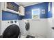 Well-lit laundry room with modern appliances and stylish decor at 7164 Sweetgrass Blvd, Hanahan, SC 29410