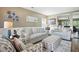 Elegant living room featuring neutral tones, wainscoting, comfortable seating, and stylish decor at 7164 Sweetgrass Blvd, Hanahan, SC 29410