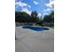 In-ground pool provides a refreshing escape, complemented by landscaped surroundings for enhanced privacy and beauty at 7164 Sweetgrass Blvd, Hanahan, SC 29410
