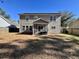 Large backyard with a screened in porch attached to the home at 7277 Sweetgrass Blvd, Hanahan, SC 29410