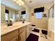Bathroom featuring a dual sink vanity, shower, tub, and purple accents at 7277 Sweetgrass Blvd, Hanahan, SC 29410