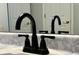 Bathroom featuring a chrome faucet and marble countertop at 7277 Sweetgrass Blvd, Hanahan, SC 29410