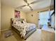Serene bedroom features a plush bed, natural light from the window, and tasteful decor at 7277 Sweetgrass Blvd, Hanahan, SC 29410