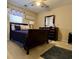 Bedroom with a dark wooden dresser, blue accents and neutral walls at 7277 Sweetgrass Blvd, Hanahan, SC 29410