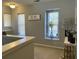 Upstairs hallway with two windows providing natural light and a decorative console table at 7277 Sweetgrass Blvd, Hanahan, SC 29410
