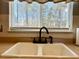 Classic kitchen sink with black faucet and window view at 7277 Sweetgrass Blvd, Hanahan, SC 29410